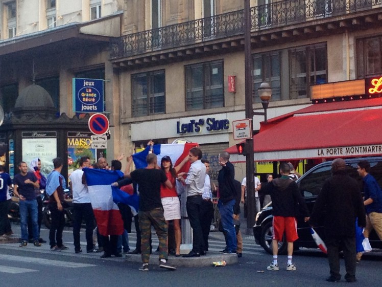 French supporters revelling on the Rue Fauberg-Monmatre in Paris
